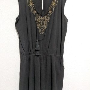 A. Byer black with gold shorts romper size xl.